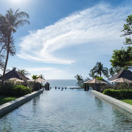balinese landscape of pool and blue sky, comfortable resort, Bali, Indonesia